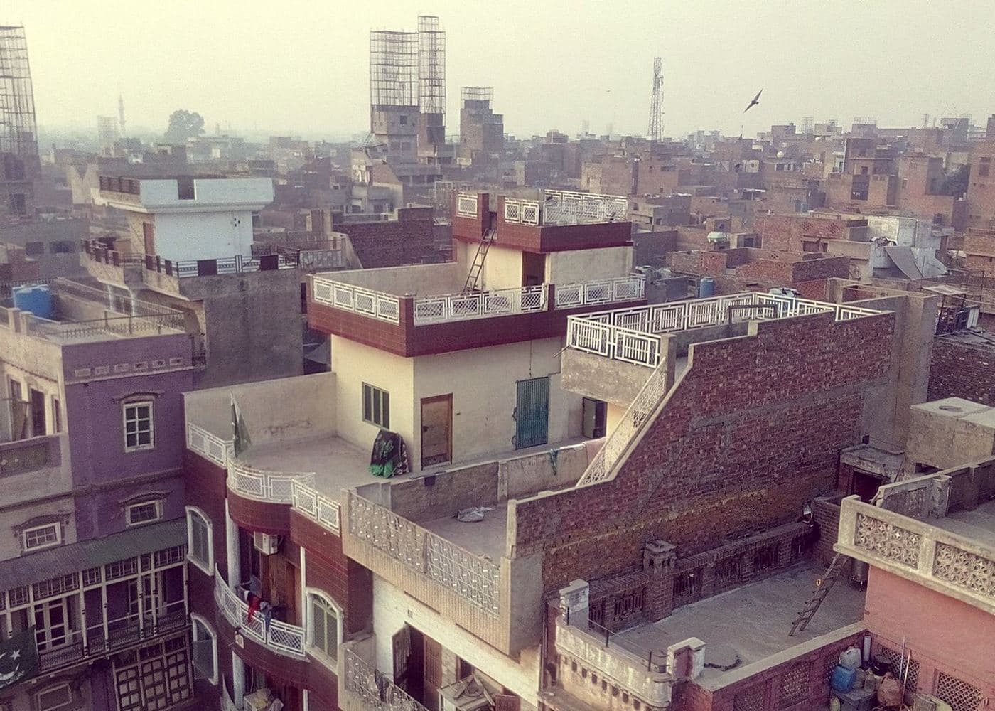 Rooftops of a dense brick neighbourhood seen from above