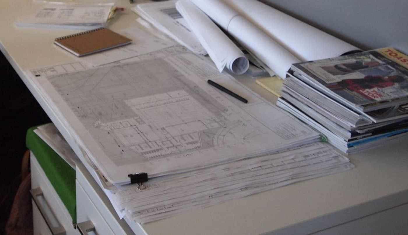 Architectural plans spread out on a desk